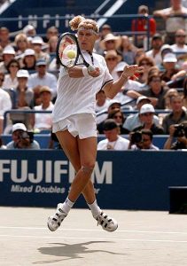 FILE -- Steffi Graf, of Germany, leaps in the air to return the ball to second seed Monica Seles of Sarasota, Fla., during the women's singles final at the U.S. Open in New York Sunday, Sept. 8, 1996. Graf, one of just five players to complete the tennis Grand Slam in one year and a dominating force for more than a decade, retired from the sport Friday August 13, 1999, saying her ``motivation wasn't what it was in the past.'' (AP Photo/Kathy Willens)